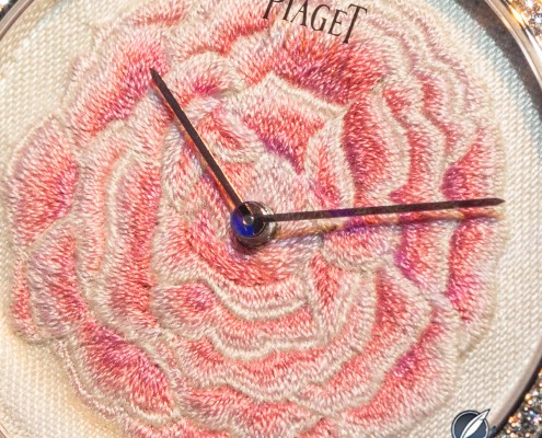 Thousands of silk stitches do into hand embroidering the Piaget Altiplano Rose dial