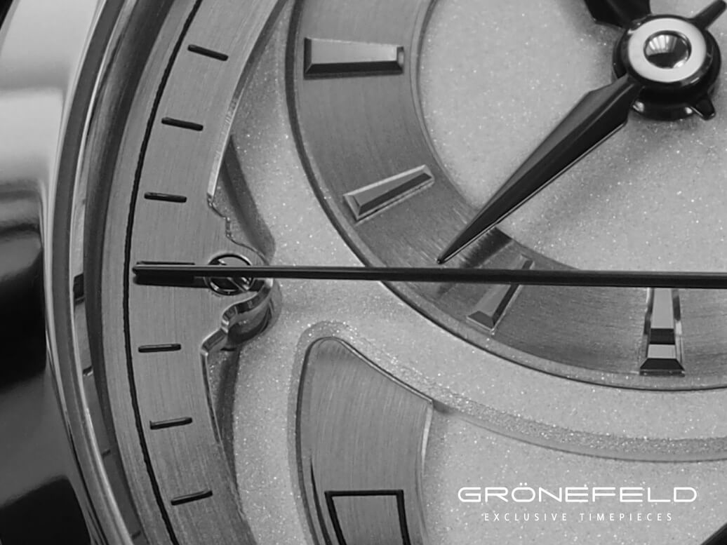The distance between the seconds hand and chapter ring is minimized to reduce parallax error on the Grondeld parallax Tourbillon