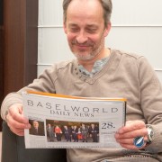 Vianney Halter reading the Baselworld News wearing his Deep Space Tourbillon