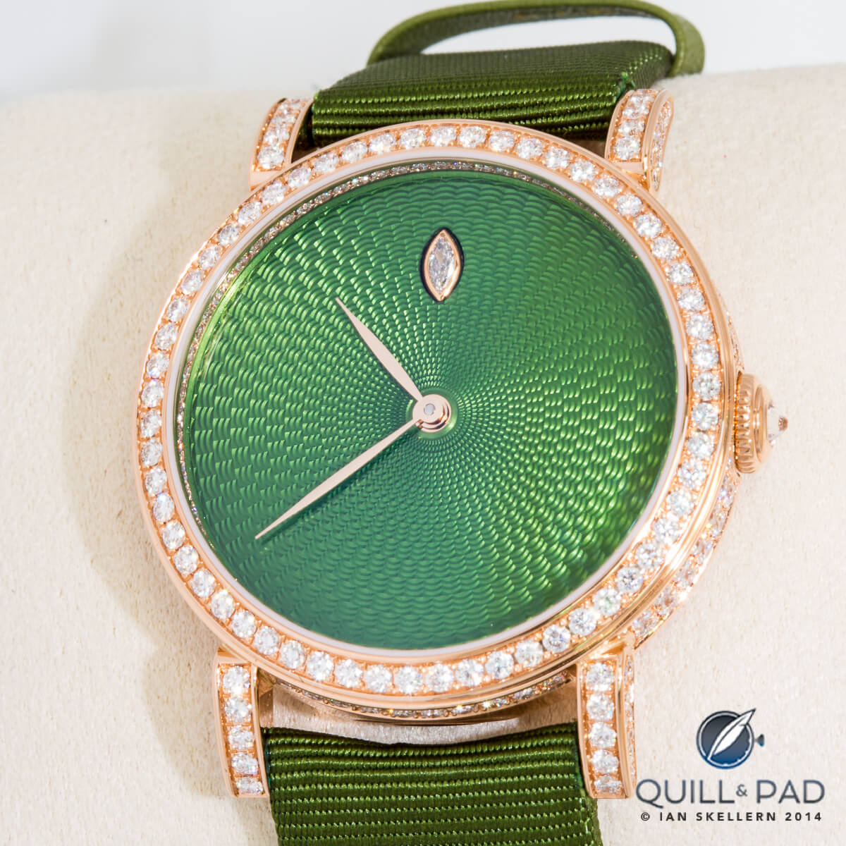 Green enamel over hand guilloche with diamond-set bezel by Delaneau