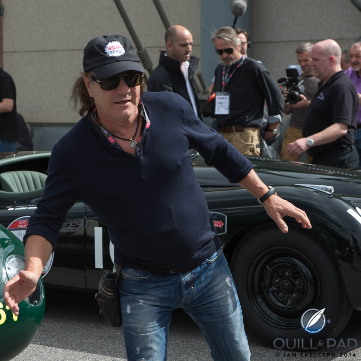 AC/DC signer Brian Johnson hamming up for the camera before checking out theJaguar C-type he will be driving in the Mille Miglia