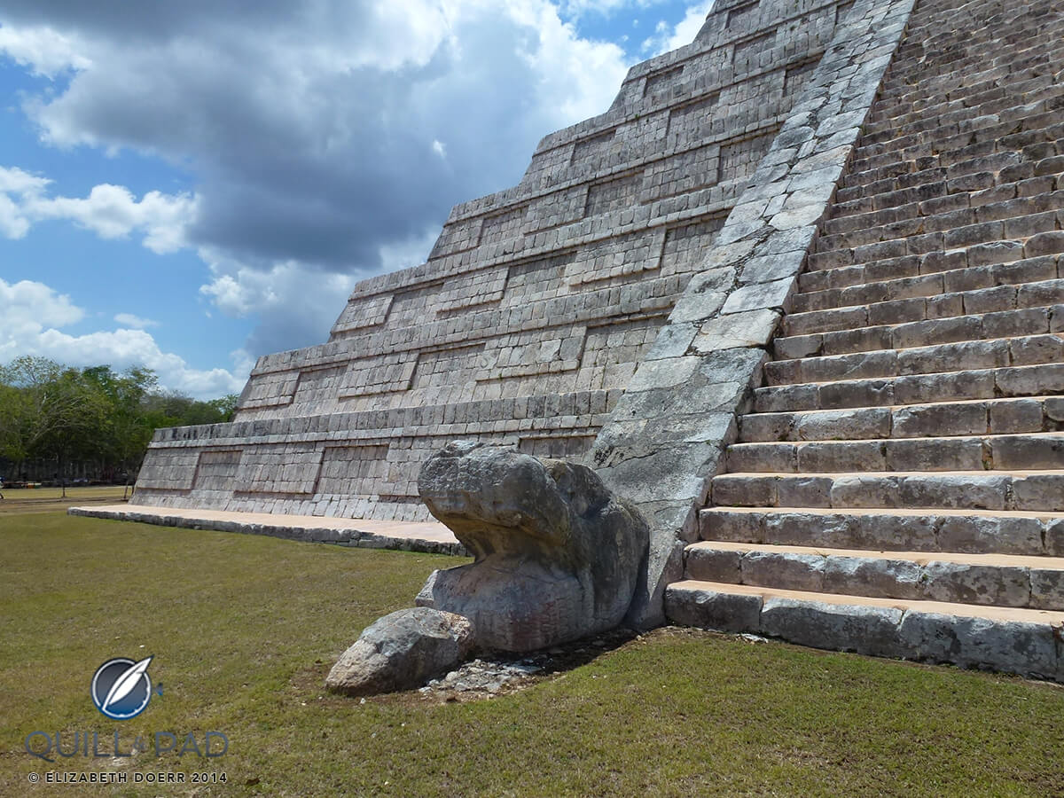 Serpent head at the bottom of the stairs of El Castillo at Chichen Itza