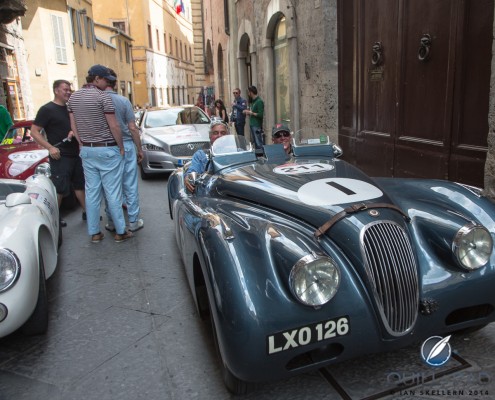 Jay Leno driving through Siena in the 2014 Mille Miglia