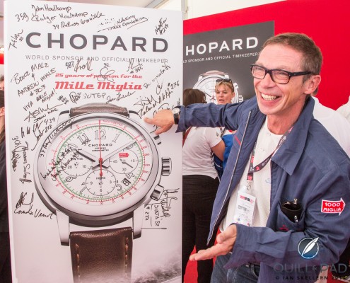 A happy Roland Iten signing the Chopard Mille Miglia poster