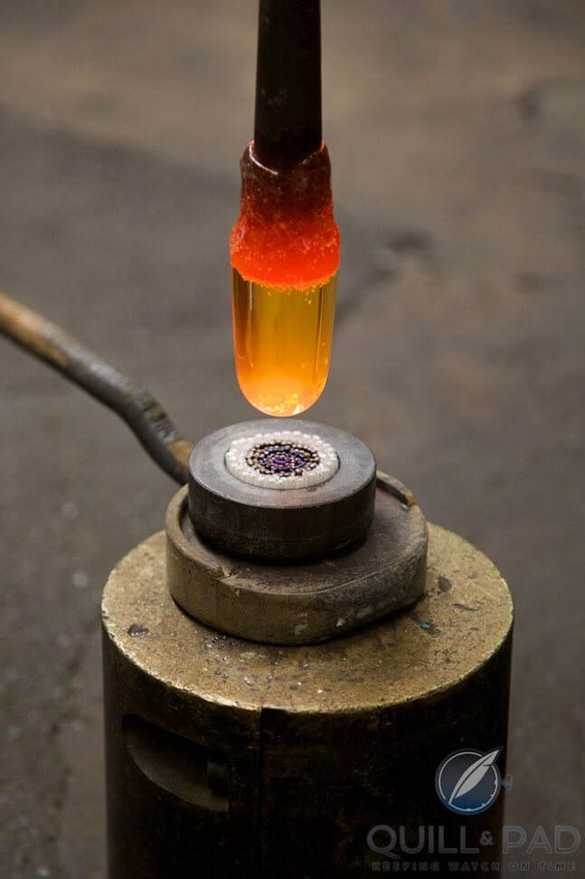 Adding a molten ball of glass to the baguettes to make a Millefiori crystal. Photo courtesy Alfredo Piola