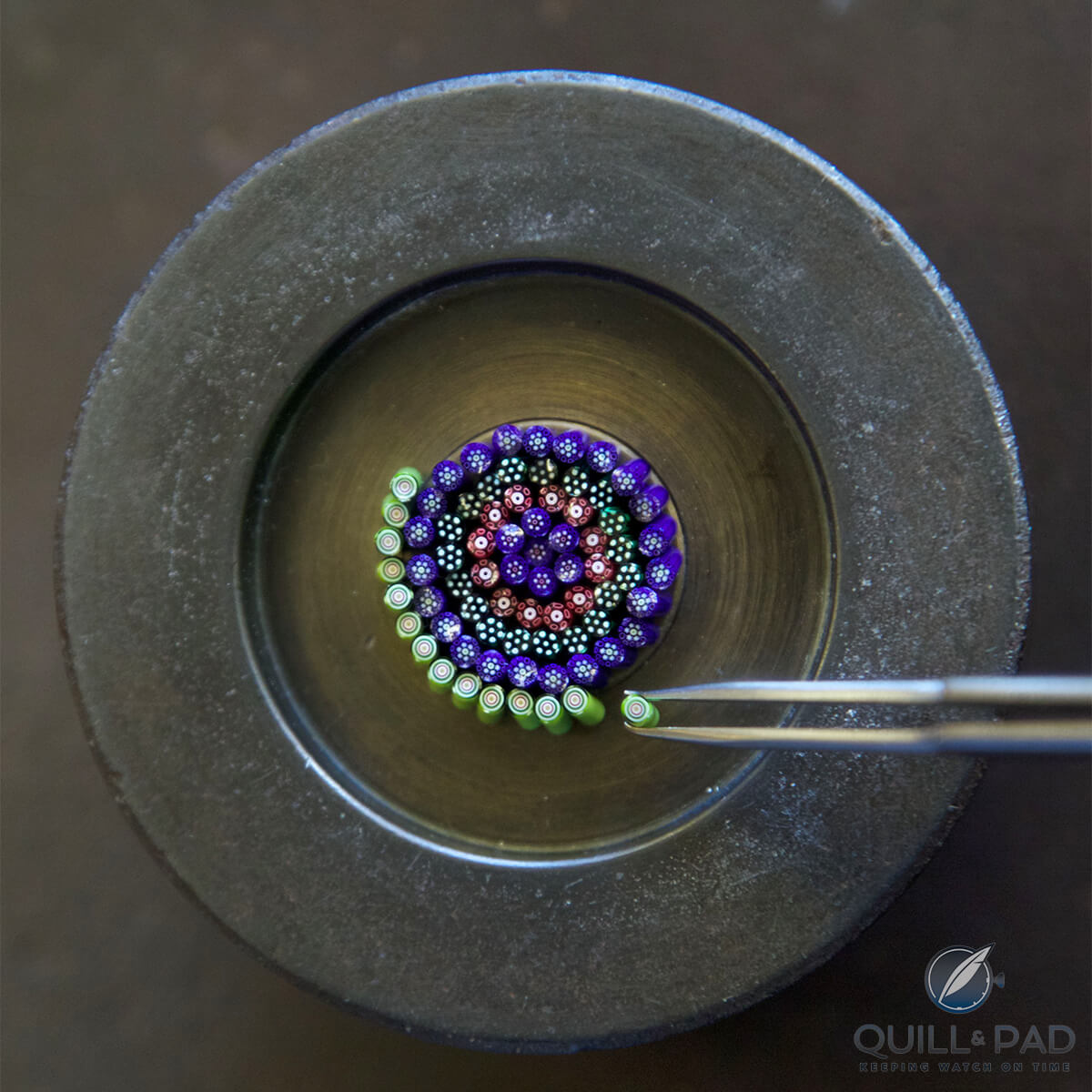 Arrangement of chopsticks (cuts of cane sections) to create a Millefiori crystal