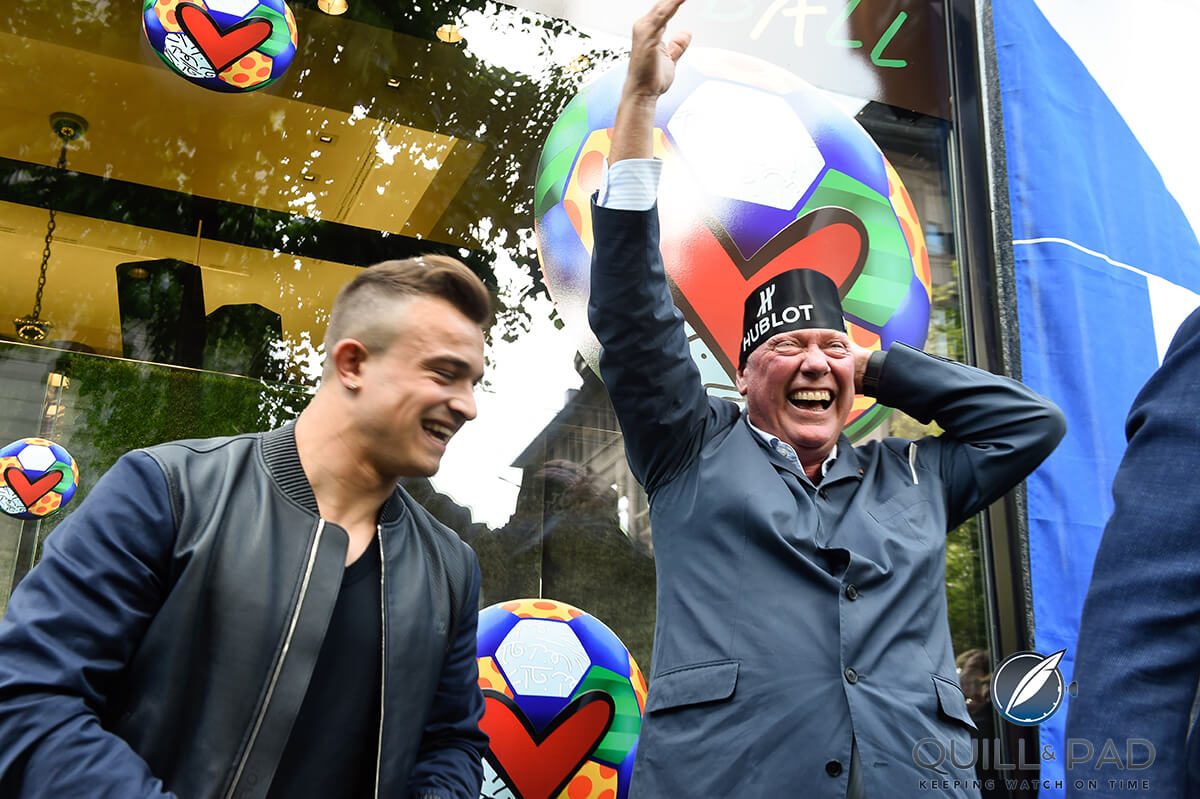 Swiss football star Xherdan Shaqiri (left) and Hublot 's Jean-Claude Biver celebrating the opening of the Hublot boutique in Zurich
