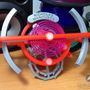 Brightly colored model of a tourbillon escapement designed by Nicholas Manousos