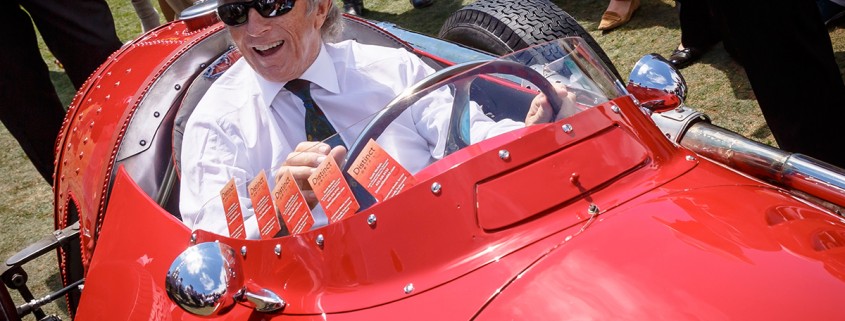 Sir Jackie Stewart in a 1955 Maserati 250F Monoposto at the 2014 Pebble Beach Concours d'Elegance