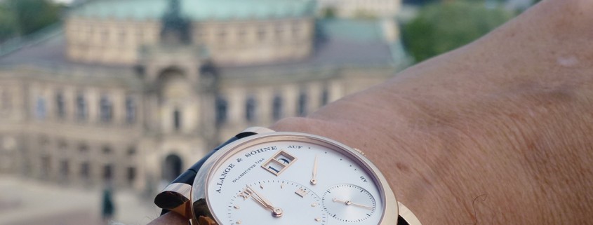 A. Lange & Söhne’s Lange 1 in red gold against the backdrop of Dresden’s Semper opera house