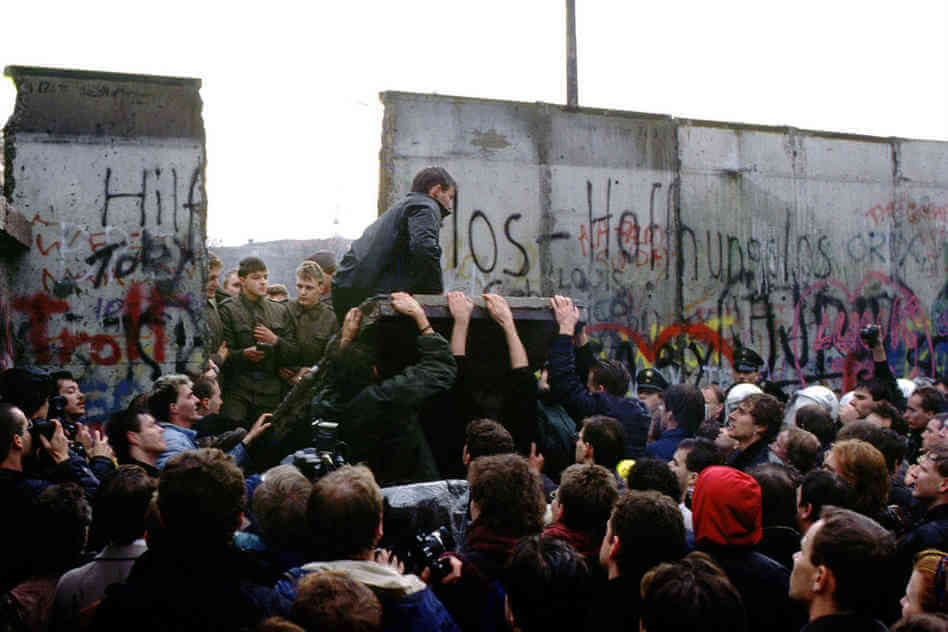 The Berlin Wall comes down (image courtesy npr.org)