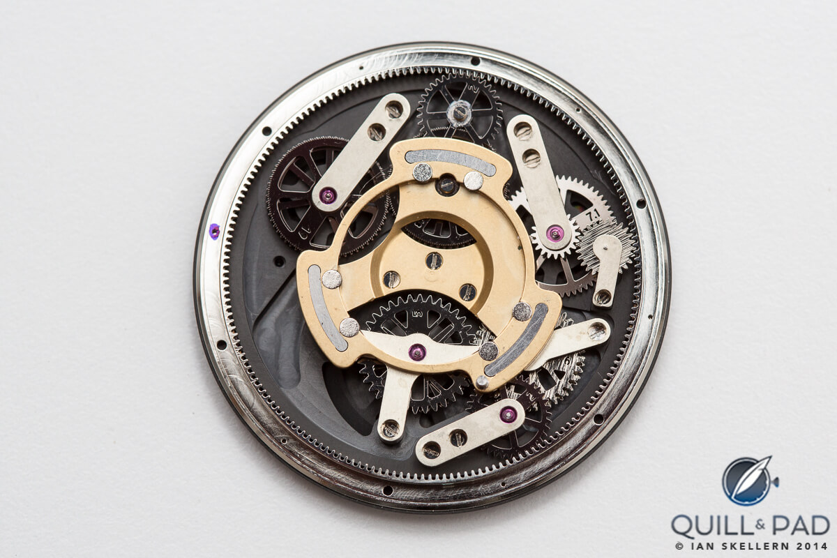 The complex system of eventually fluid-filled gearing under the dial of the Ressence Type 3; these gears are driven by magnets so as to minimize perforations in the fluid-tight upper section