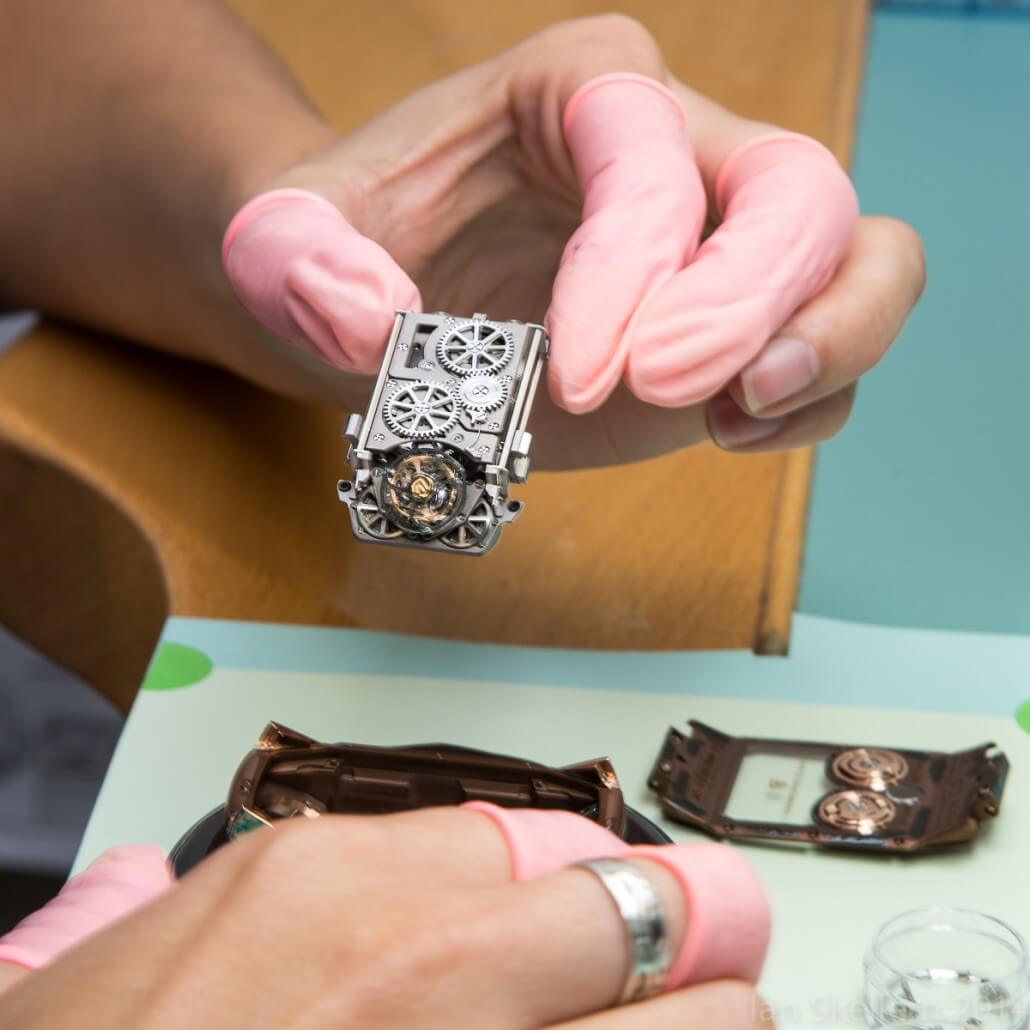 Carefully placing the movement of the Christophe Claret X-TREM-1 into its case from the back