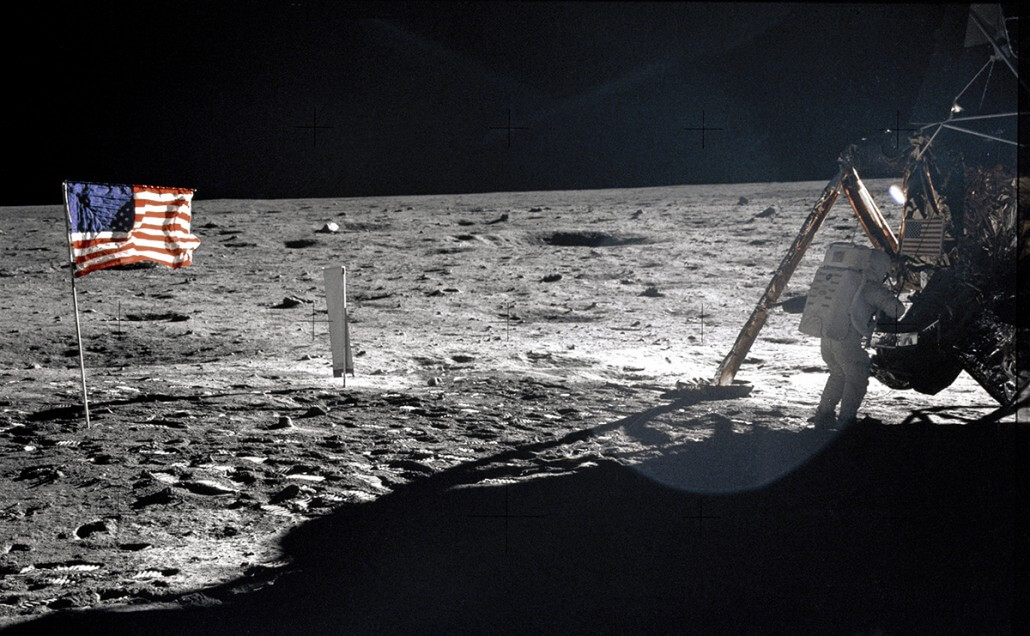 Neil Armstrong (beside lunar lander) on the moon