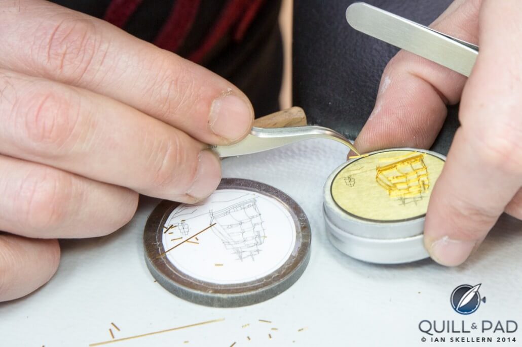 To achieve cloisonné enamel, tiny gold wires are first cut and shaped against a template (left) before being carefully positioned on the dial (right)