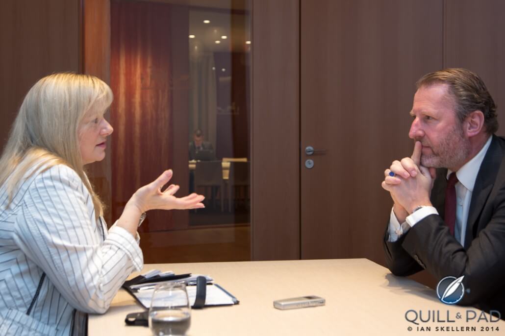 The author Elizabeth Doerr chatting with Guillaume de Seynes of Hermès