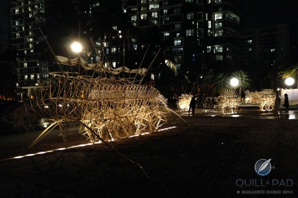 Three of Theo Jansen's Strandbeests venturing out of their lairs in Miami at night