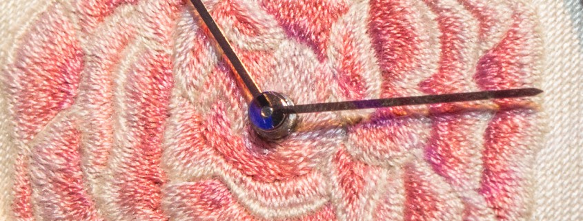 Thousands of silk stitches do into hand embroidering the Piaget Altiplano Rose dial