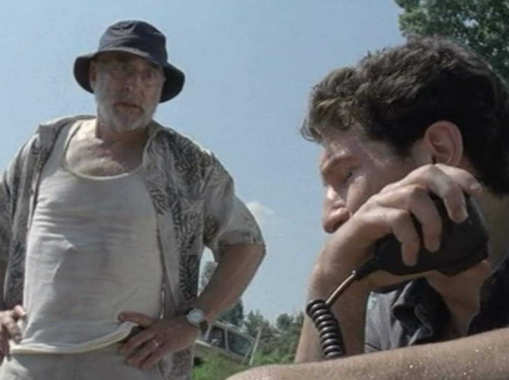 Dale looks at Shane, ever-present watch on wrist, in 'The Walking Dead'
