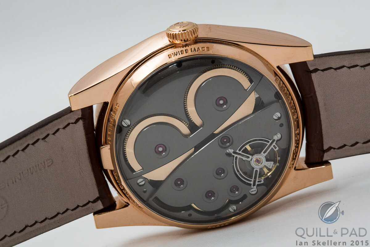 View through the display back of the Emmanuel Bouchet Complication 1 in pink gold: the two large spring barrels are clearly visible against the dark plates