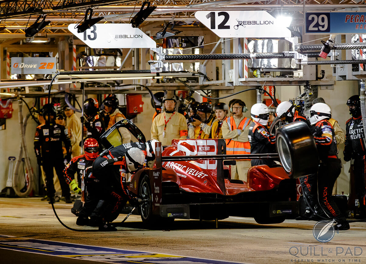 The Rebellion team makes a nighttime pit stop (photo courtesy caracing.com)