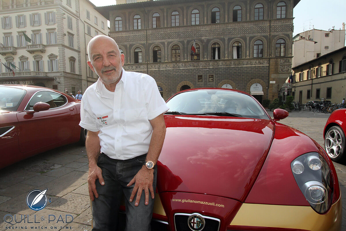 Giuliano Mazzuoli resting on his Alfa Romeo Gran Turismo 8C