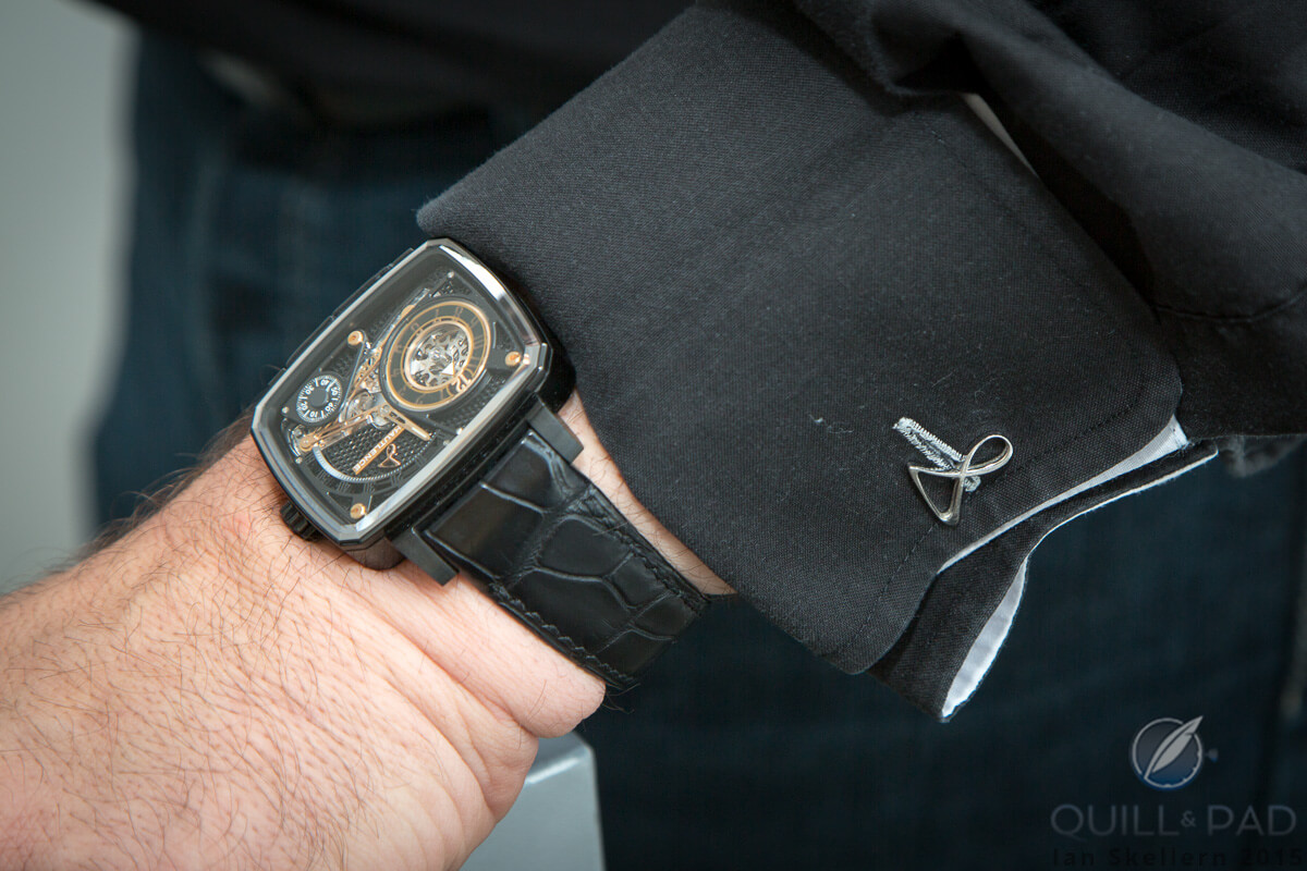 Hautlence HL Black Ceramic on the wrist of brand co-founder and CEO Guillaume Tetu; note the cool cufflinks in the form of the Hautlence logo
