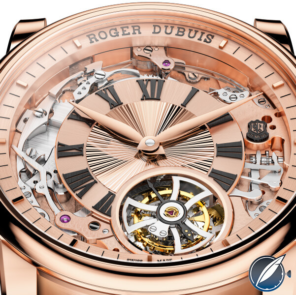 The dial of the Roger Dubuis Hommage Minute Repeater Tourbillon Automatic is flanked on three sides by the minute repeater mechanisms at at the bottom by the tourbillon