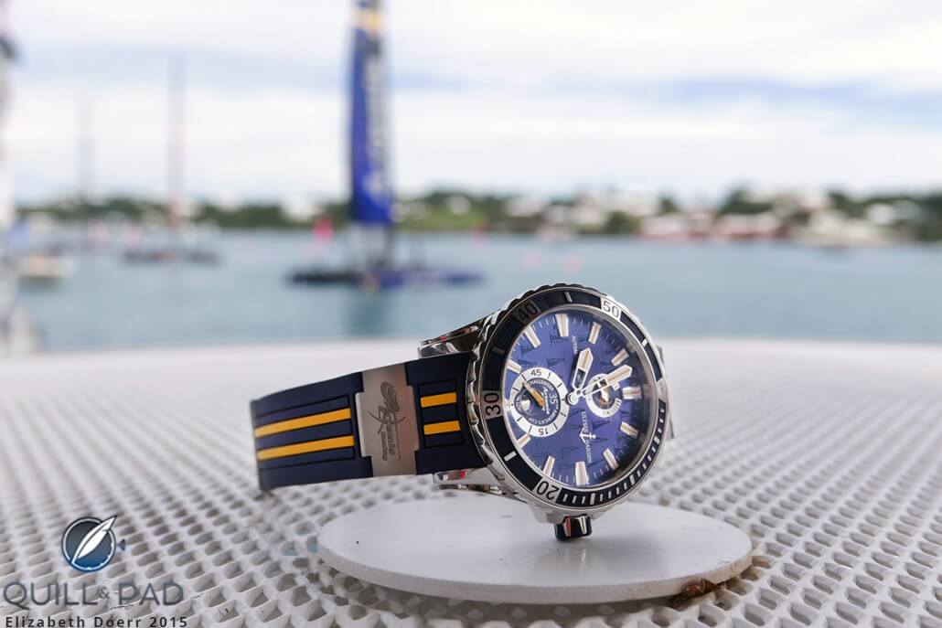 The Ulysse Nardin Marine Diver Artemis Racing in Bermuda with boats racing in the America’s Cup challenger series in the background