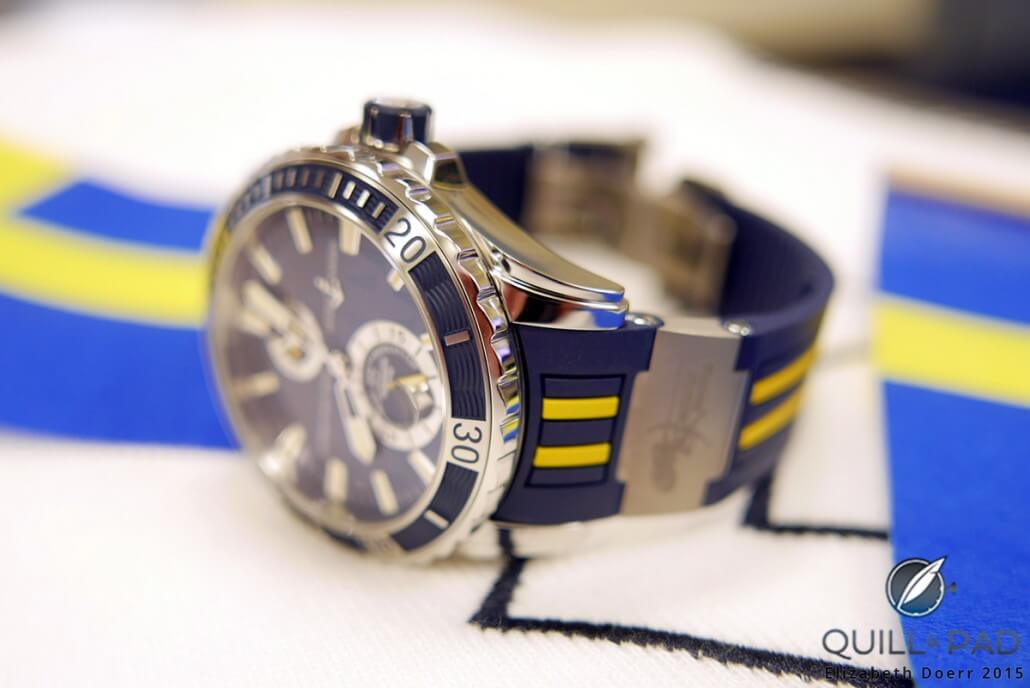 A look at the side of the Ulysse Nardin Marine Diver Artemis Racing reveals the wave patterning on the bezel and the engraved stainless steel elements enhancing the blue-and-yellow rubber strap