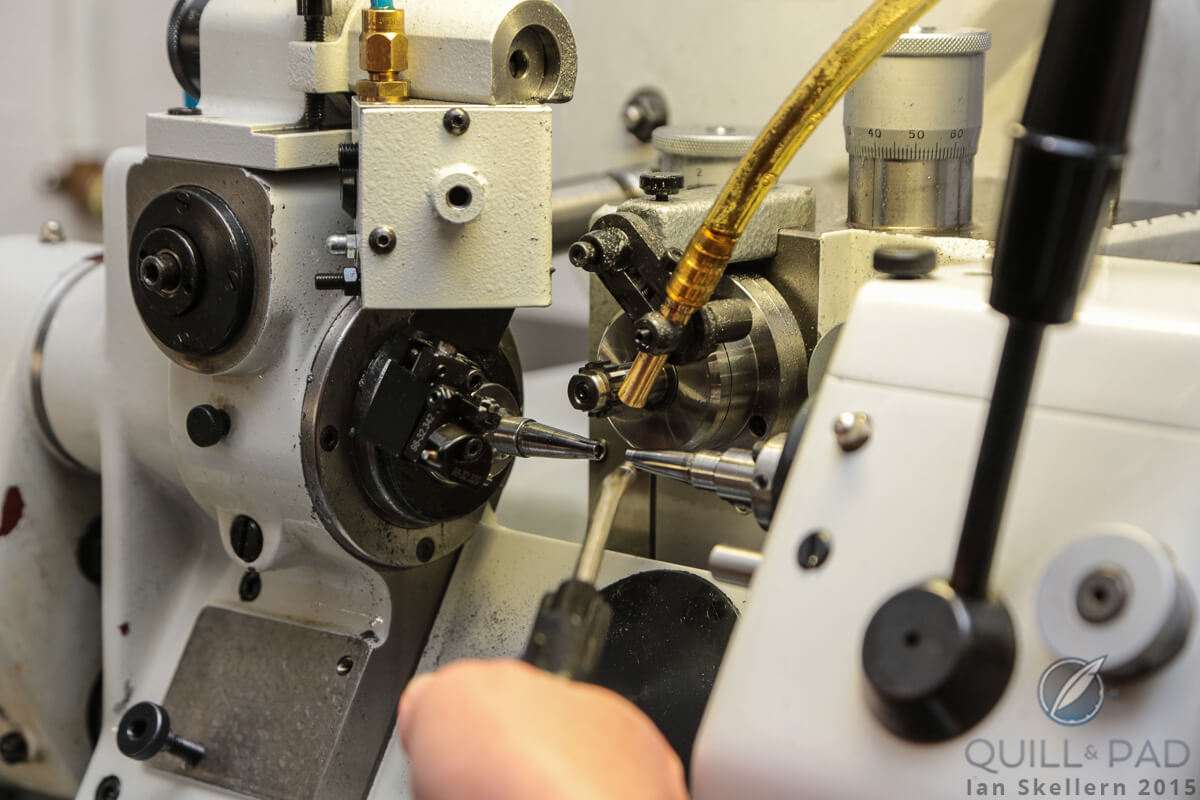 The business end of an automatic lathe at the Nomos manufacture where the component being turned spins while the cutting tool is stable