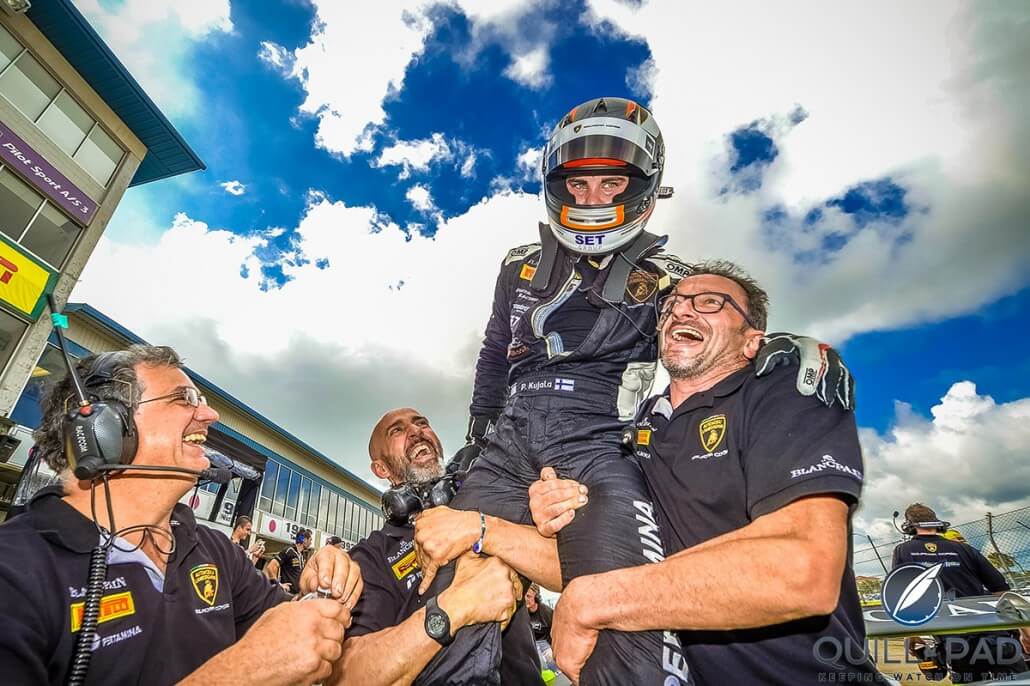 The winner of the 2015 Blancpain Super Trofeo Pro category, Finnish driver Patrick Kujala, lifted high in celebration