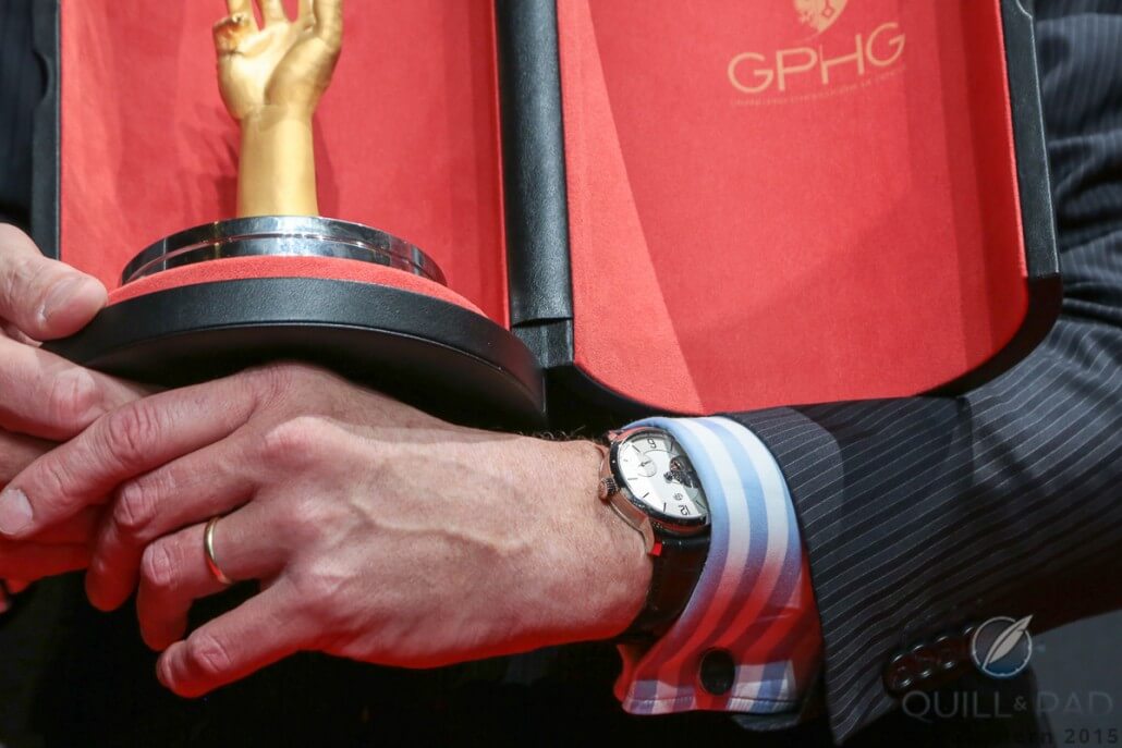 Stephen Forsey at the 2015 Grand Prix d’Horlogerie de Genève with the Aiguille d'Or in one hand and a Greubel Forsey Tourbillon 24 Secondes Vision on the other