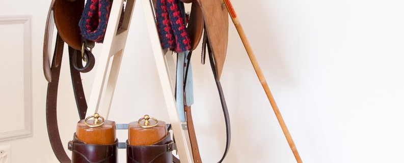 saddle, books and polo stick