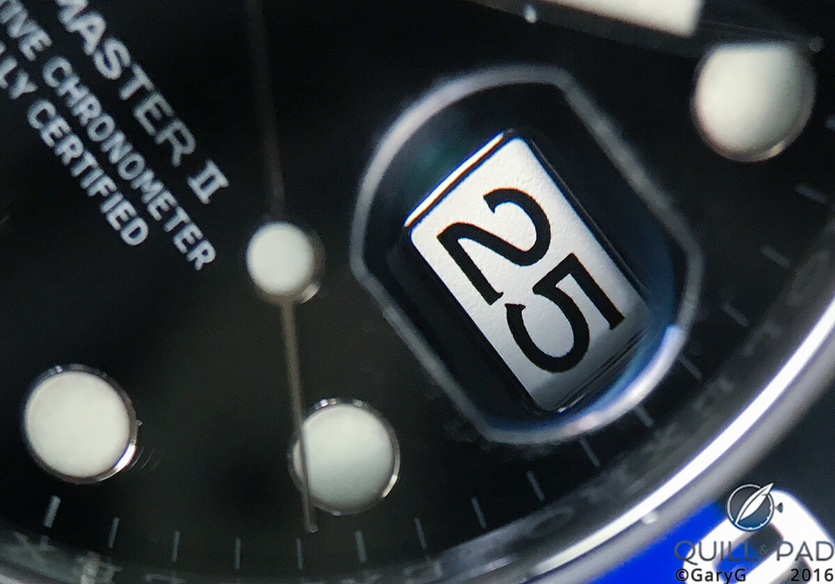 Dial detail: date indication seen through the Cyclops lens on the Rolex GMT Master II