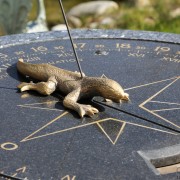 The gnomon projects from the back of the lizard in this sundial at Agenhor in Geneva