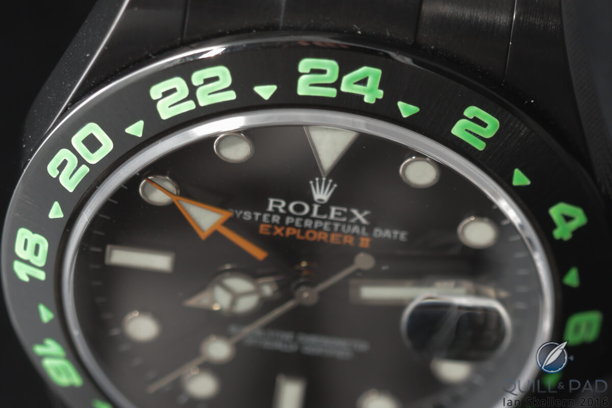 Electric green numerals on the bezel on this blackened Rolex Explorer II
