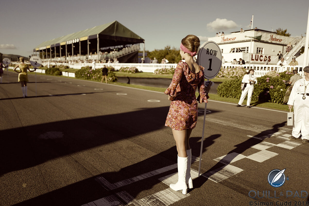 A grid girl at the Goodwood Rival dressed as she might have done in 1966
