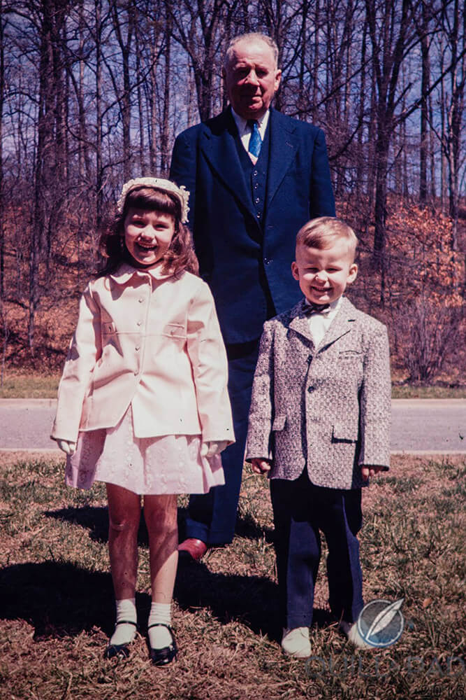 A boy, his sister, and their grandfather at Easter, 1959