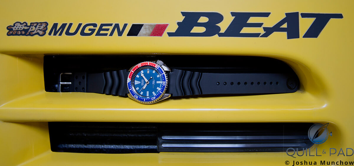 Seiko 7002 Diver nestled in an air vent of the author's Honda Mugen Beat
