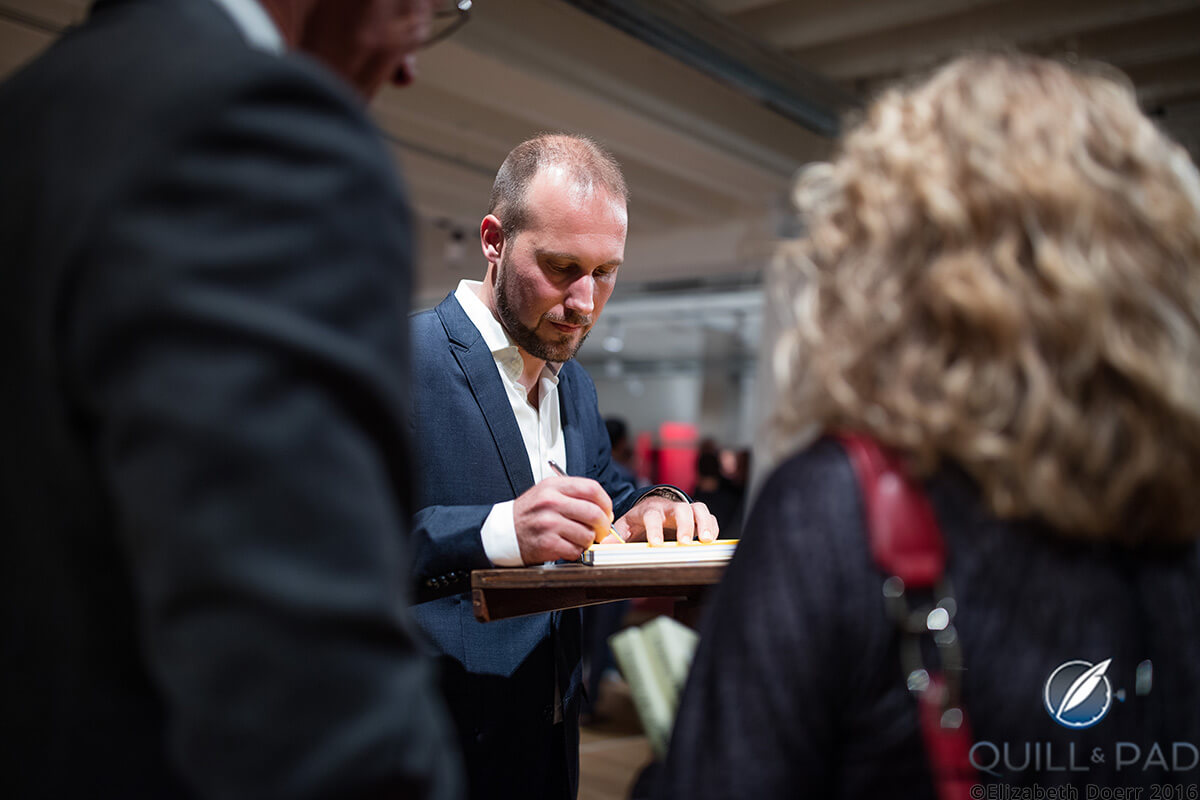 Journalist and author Louis Nardin signing copies of his books at the launch party for ‘The Magic of Watches’ in October 2016