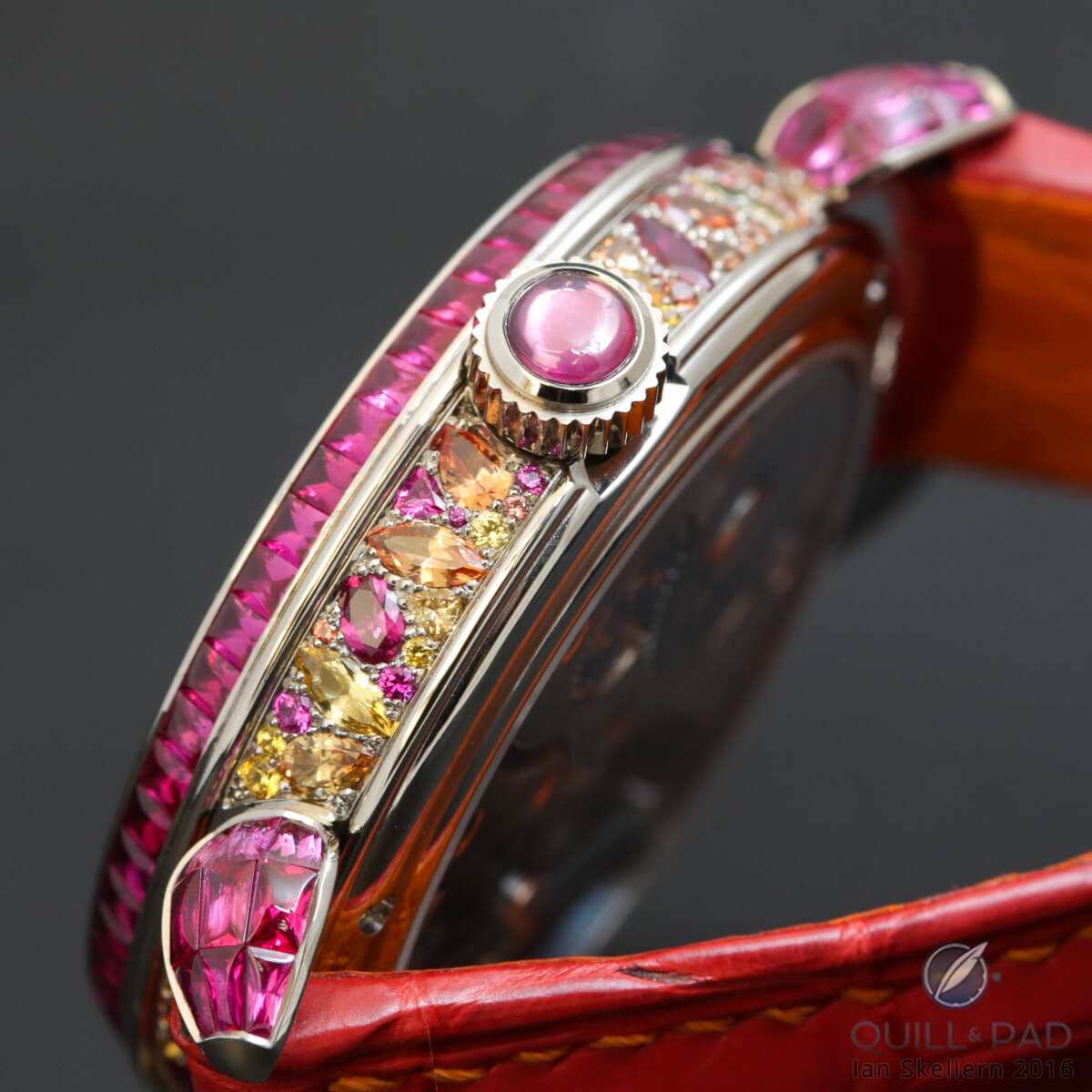 Intricately and colorfully gem set case band of the Voutilainen Scintillante