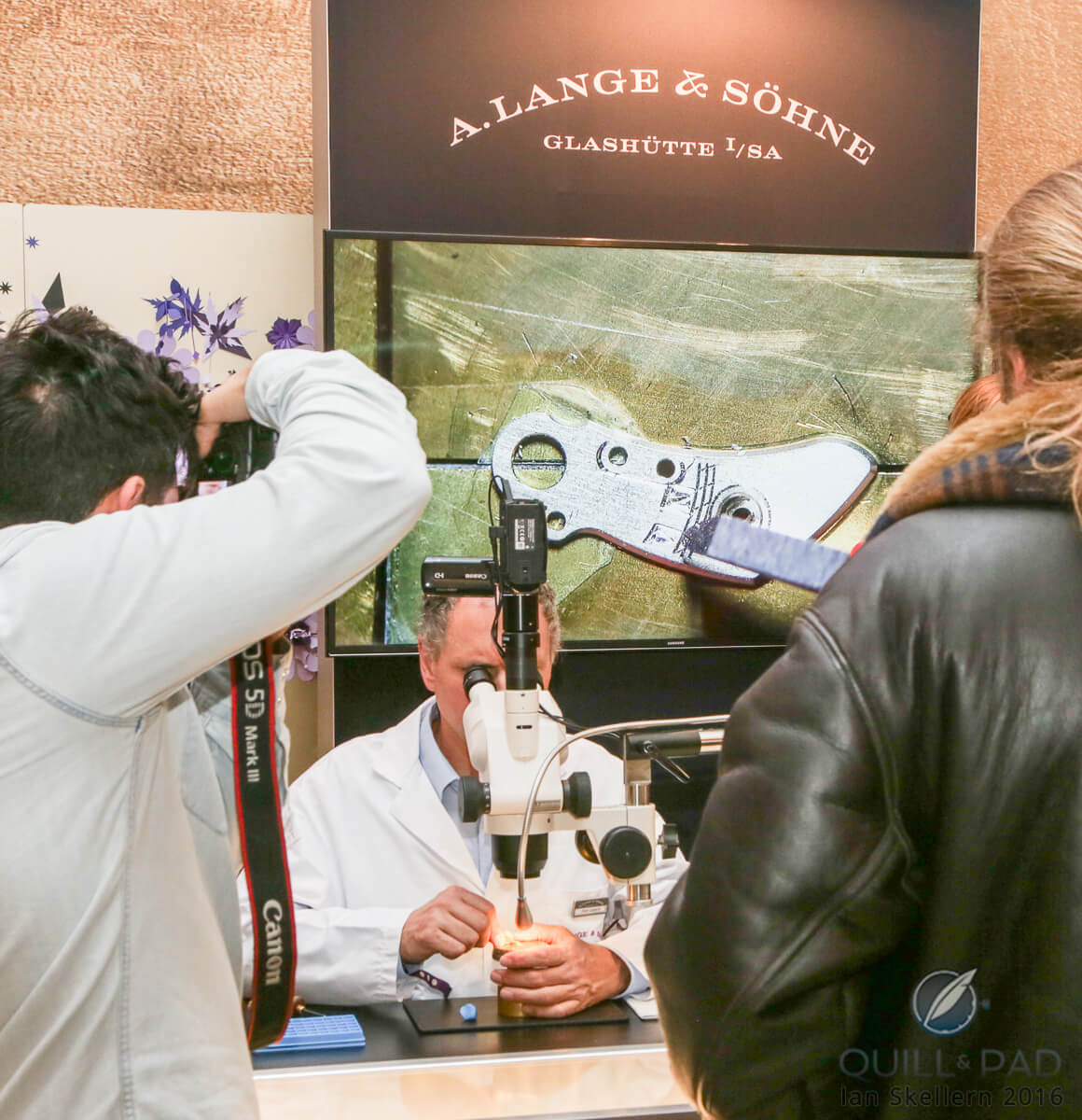 A. Lange & Söhne engraving demonstration at SalonQP 2016, the screen behind is a live macro video