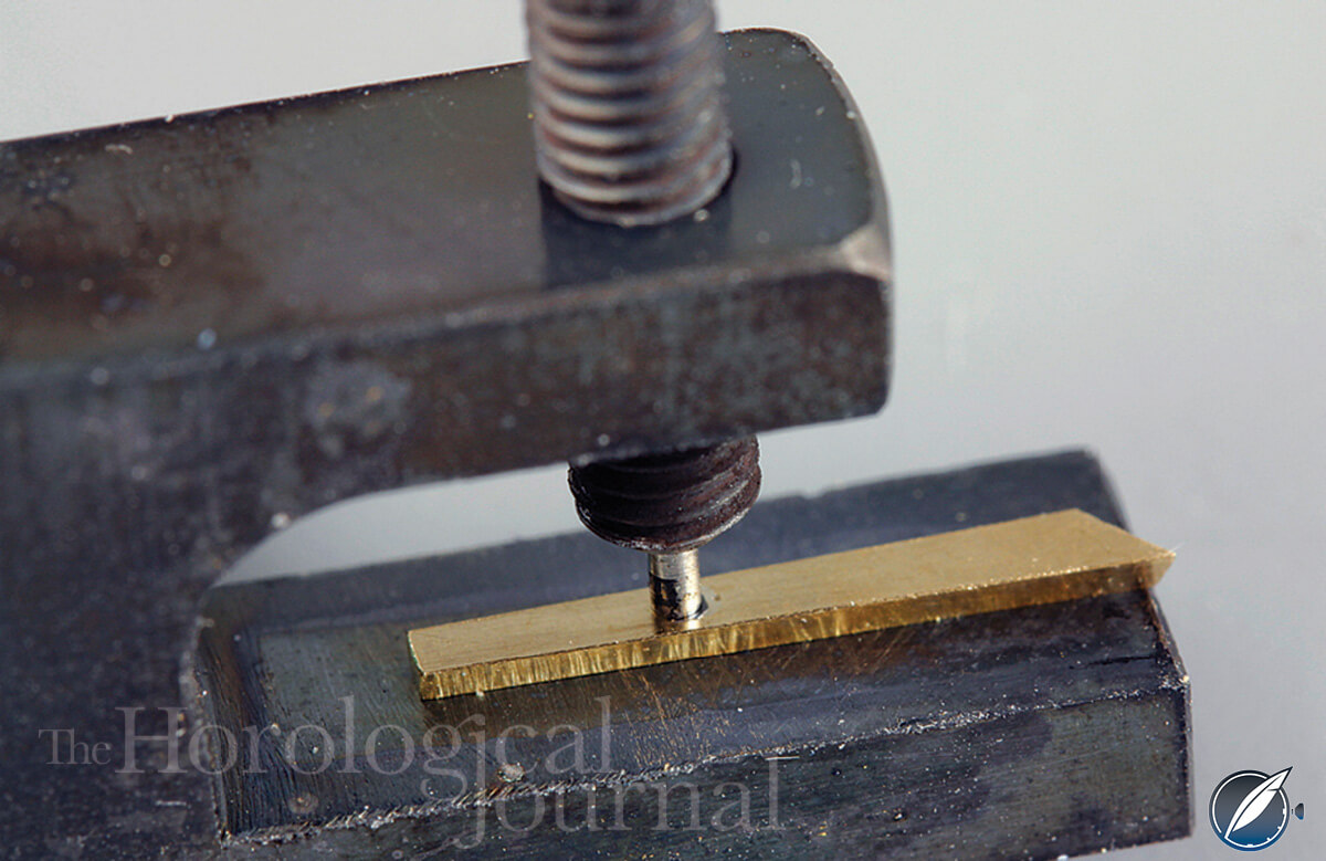 Clamping diamond in brass end piece whilst soldering (photo courtesy British Horological Journal)
