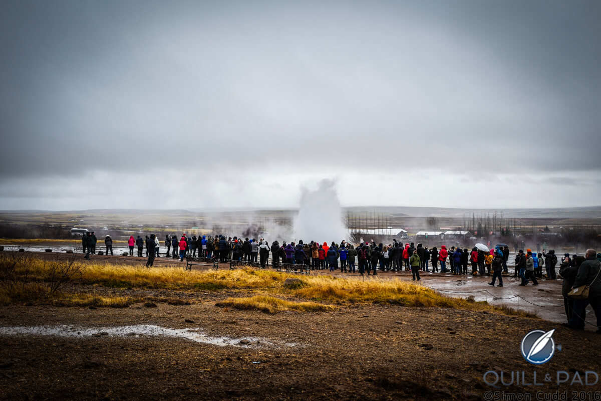 Onlookers at anerupting geyser in Iceland