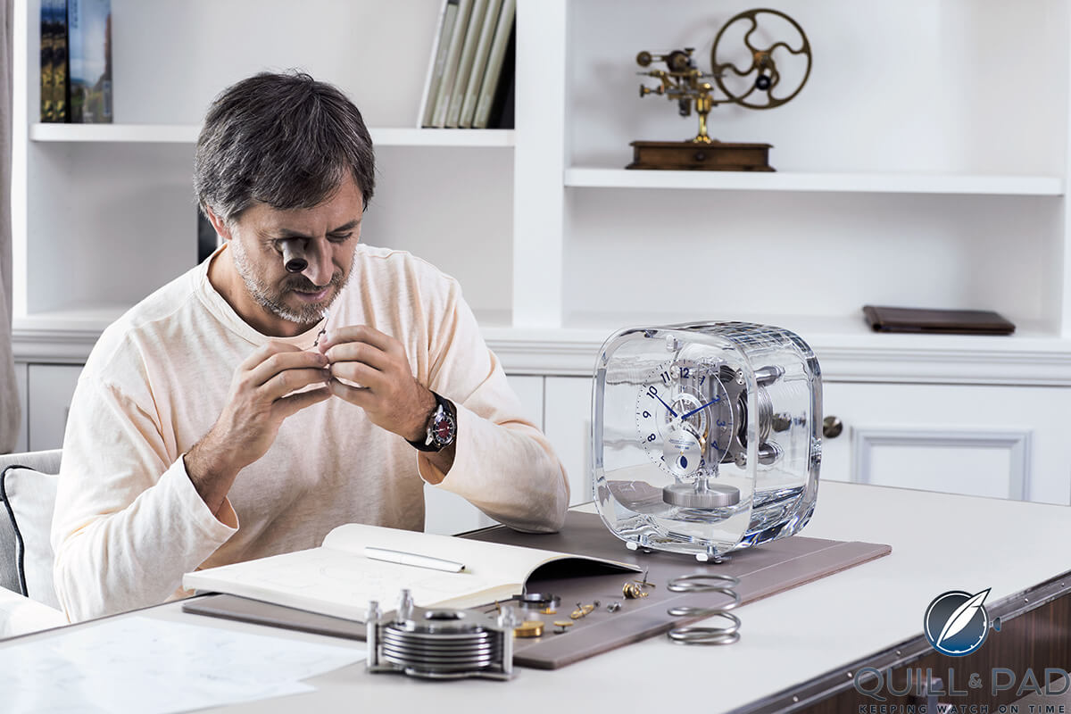 Marc Newson examining the Jaeger-LeCoultre Atmos 568 he designed