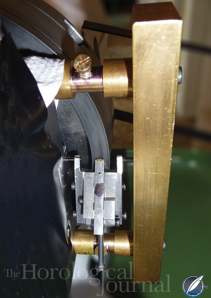 Pivoted pallet holder and lap mounted on the lathe to make the diamond pallets for Derek Pratt's H4 reconstruction (photo courtesy British Horological Journal)