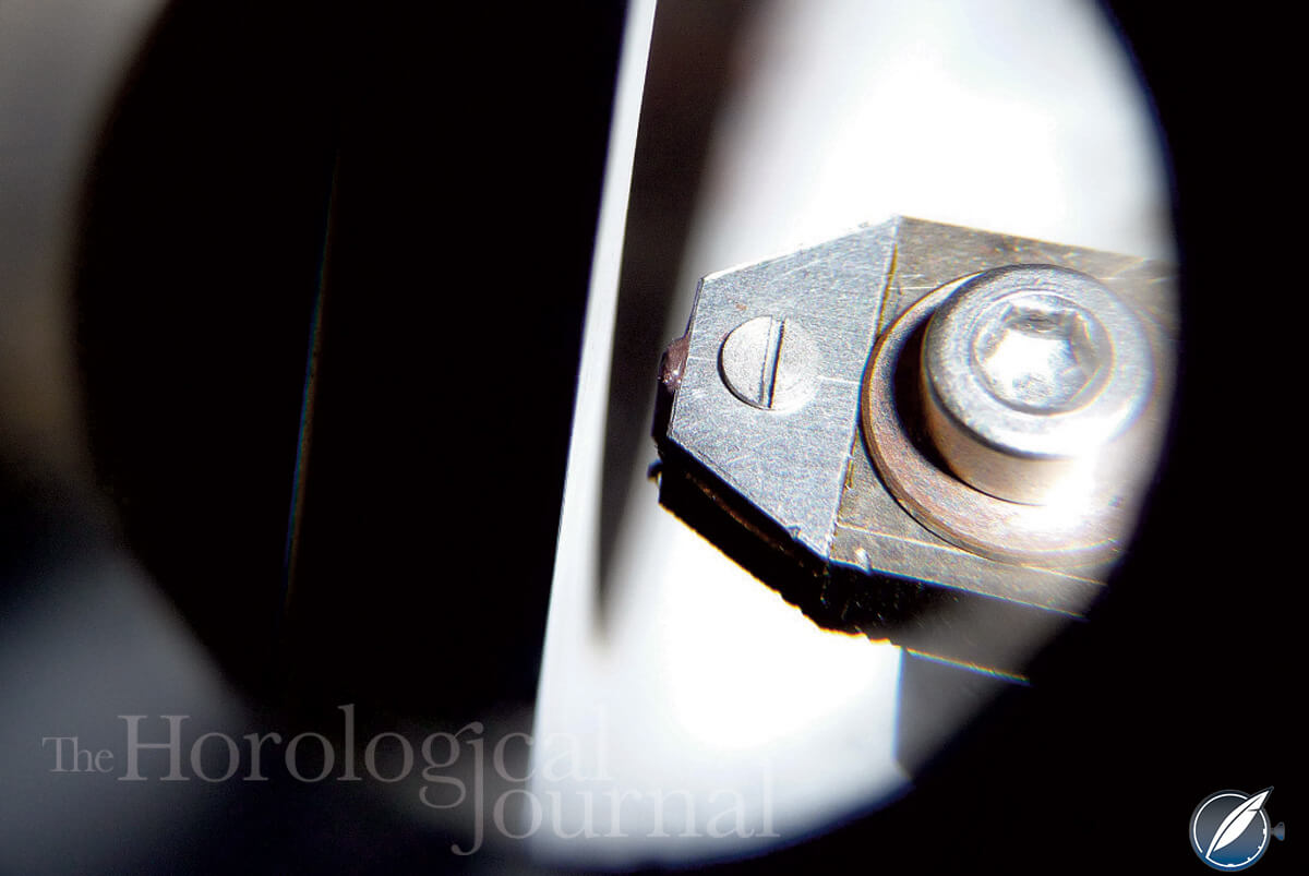 Grinding the impulse face of a diamond pallet for Derek Pratt's H4 reconstruction (photo courtesy British Horological Journal)