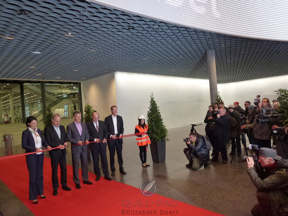 Cutting the ribbon on the new Baselworld buildings: (l to r) Pierre de Meuron (architect), René Kamm (MCH), Ulrich Vischer (MCH), and Peter Holenstein (MCH, project leader)