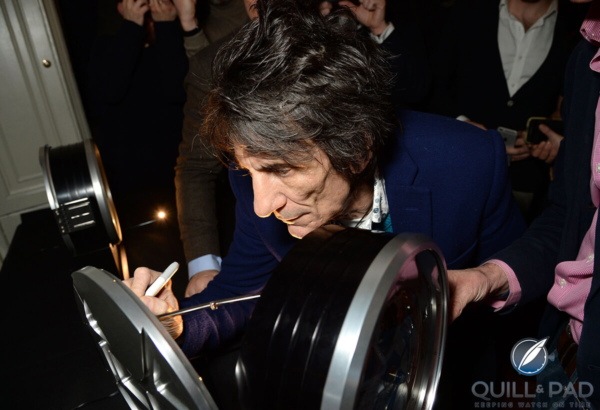 Ronnie Wood signs the second Bremont B-1 clock featuring one of his hand-painted dials during the brand’s Townhouse event (photo courtesy Richard Young)